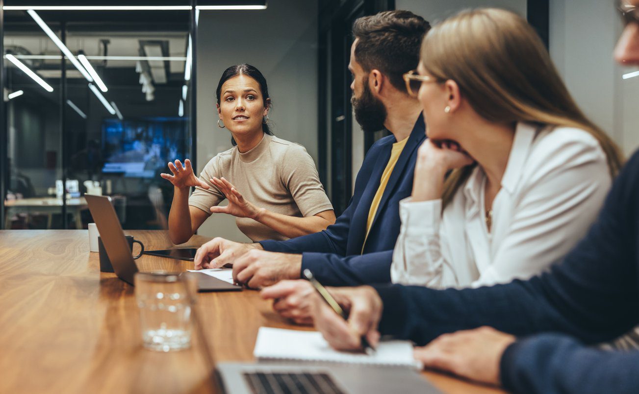 Young businesswoman leading a discussion during a meeting Young businesswoman leading a discussion during a meeting